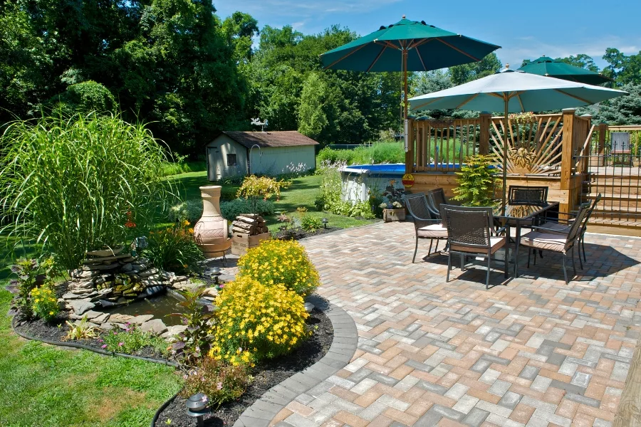 stone patio with table and pool